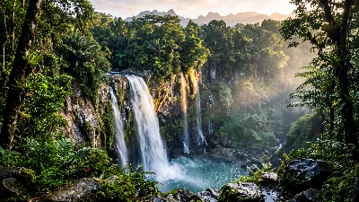 Mist‑Veiled Tropical Waterfall